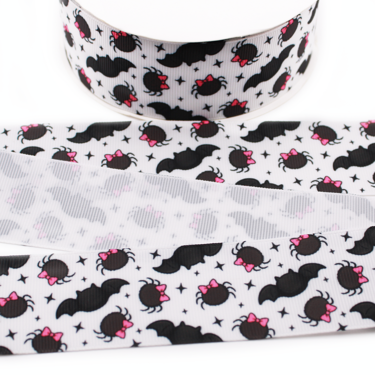 Bats and Spiders printed grosgrain ribbon with black bats, spiders with pink bows and black stars on a white background.