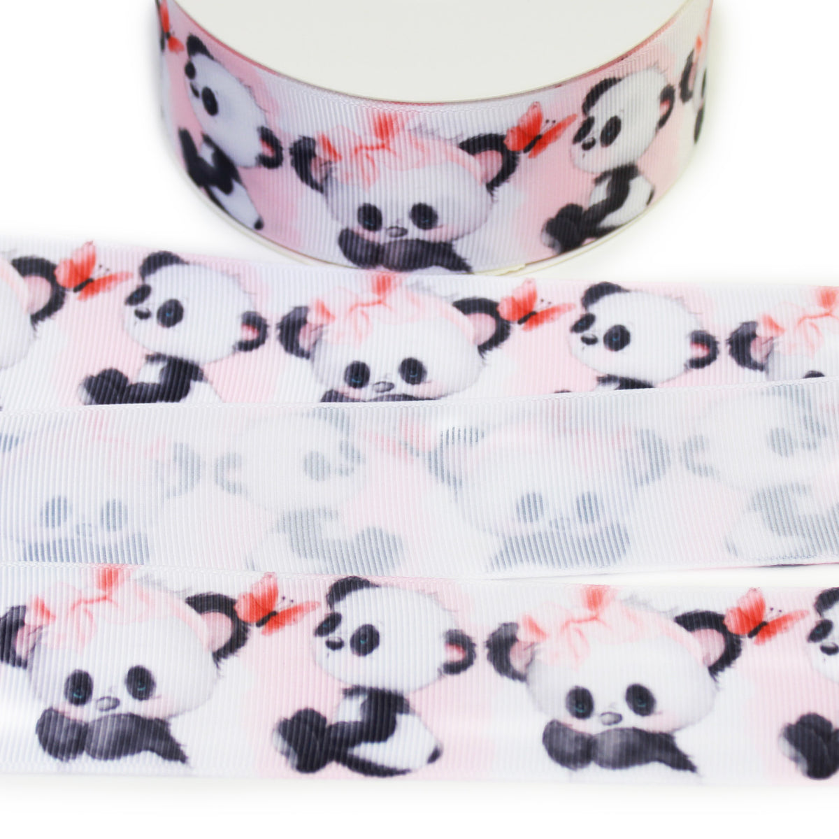Panda printed grosgrain ribbon featuring cute black and white pandas, pink bows and butterflies on a soft blush pink background.