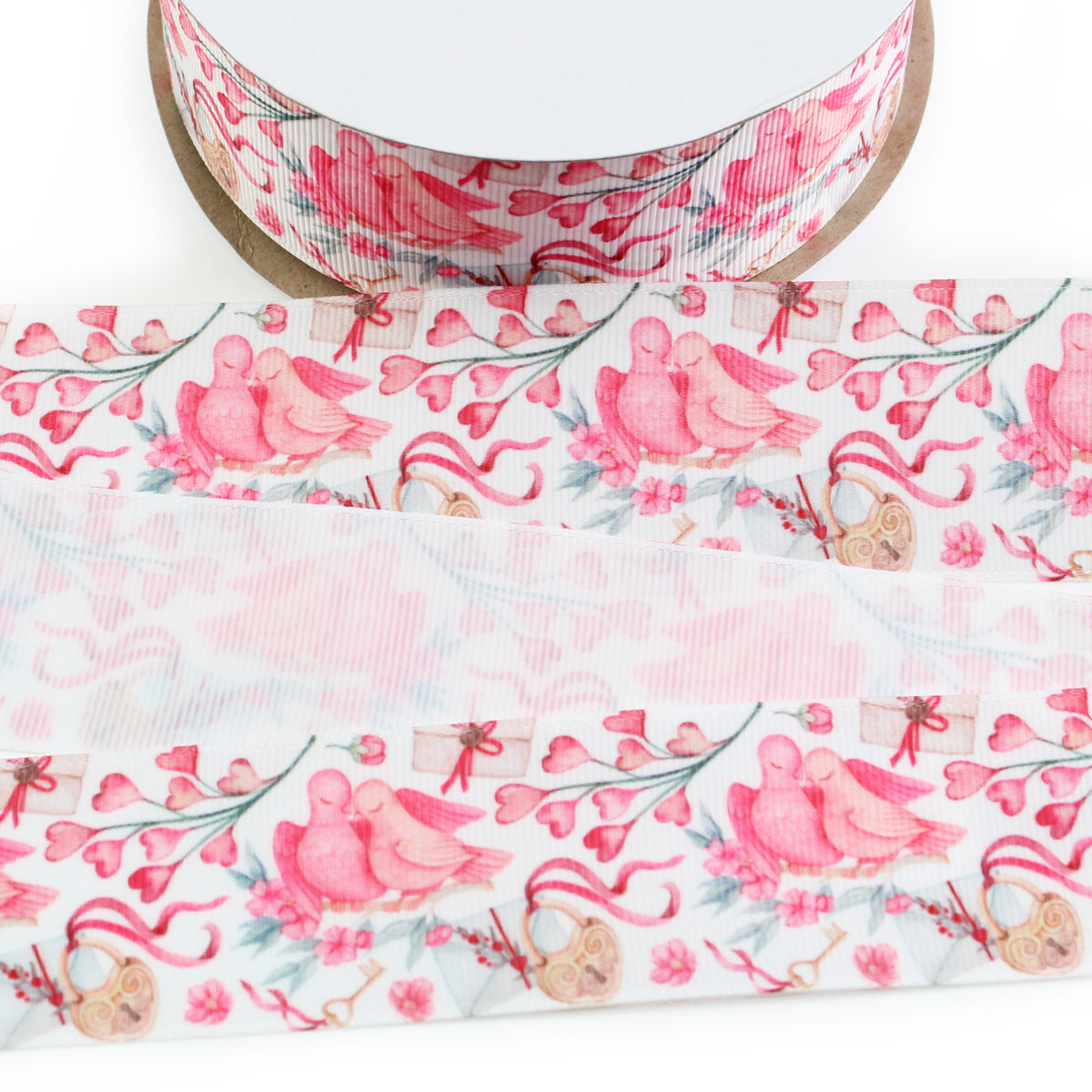 Love Birds Valentine printed grosgrain ribbon featuring pink birds perched together, heart-shaped flowers, pink ribbons, vintage keys, and heart-shaped locks on a white background.