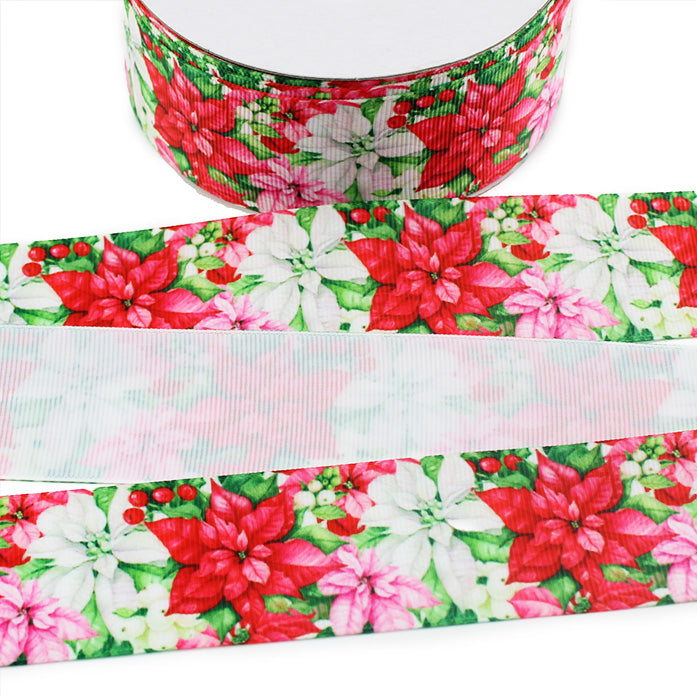 Christmas poinsettia printed grosgrain ribbon featuring red, white and pink poinsettias with green leaves and red berries on a light background.