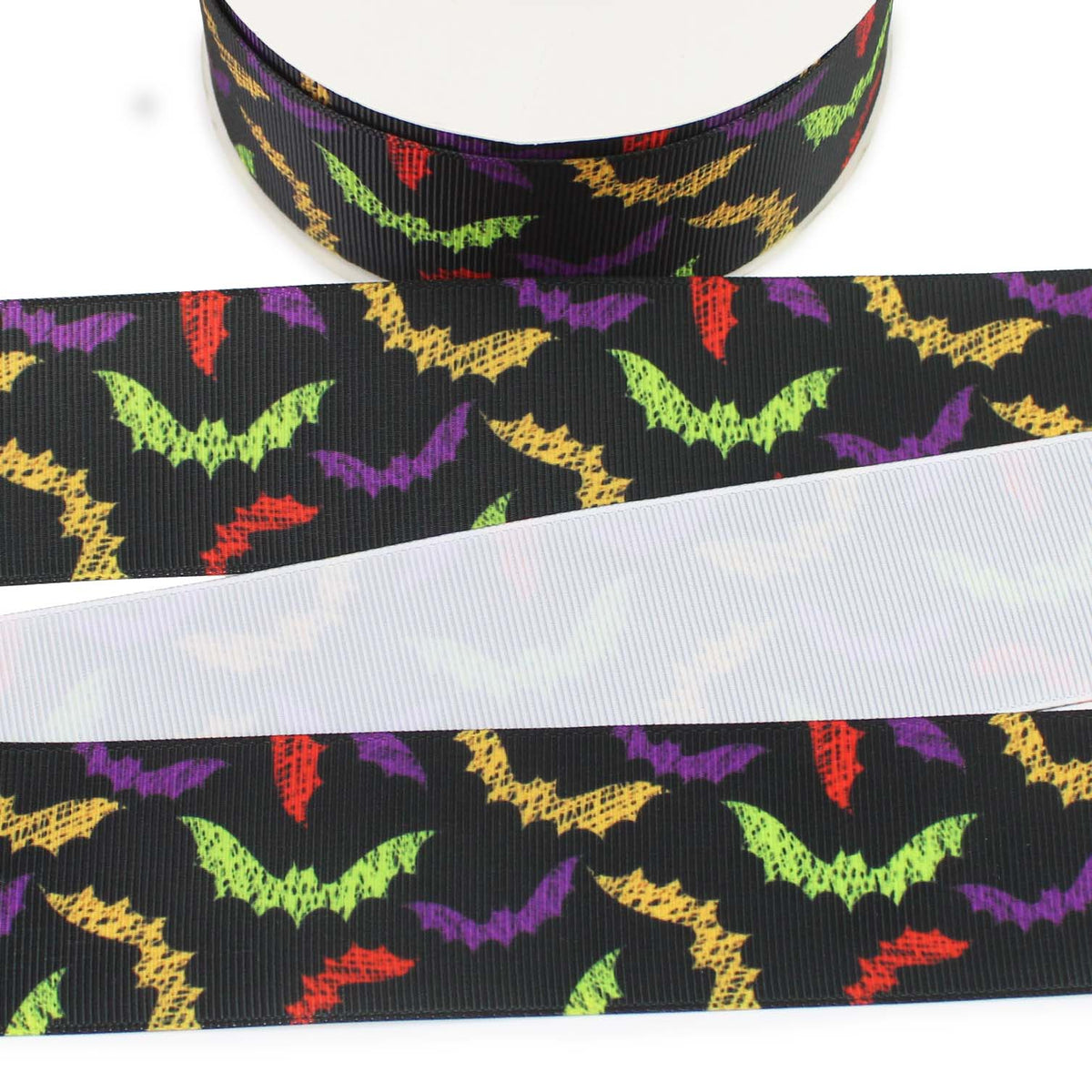 Colorful Bats printed grosgrain ribbon with green, purple, orange and red bats on a black background.
