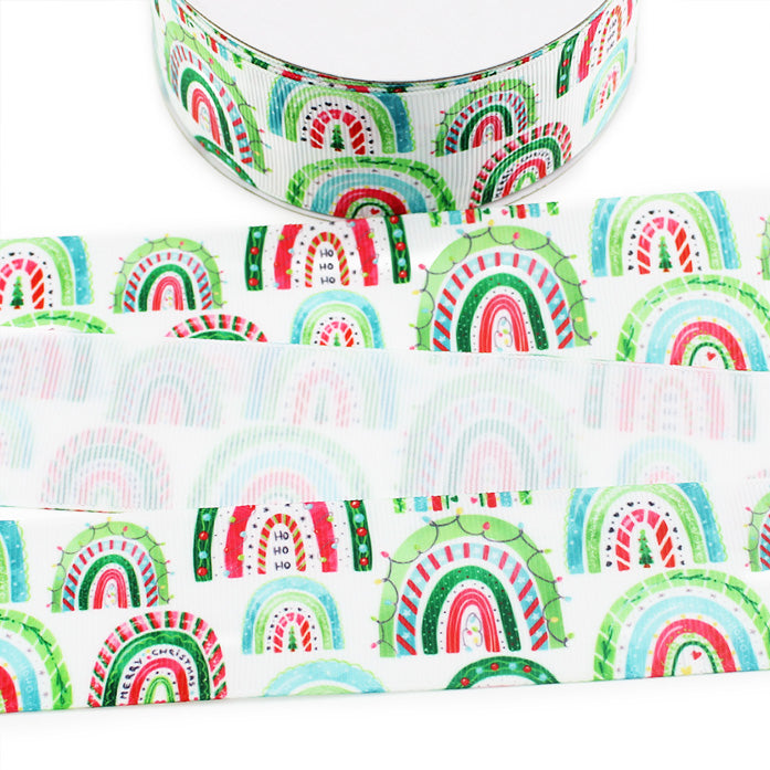 Christmas Rainbow printed grosgrain ribbon with red, green and aqua holiday rainbows featuring Christmas trees, lights and festive details on a white background.