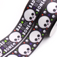 Bad to the Bone printed grosgrain ribbon with cute white skulls, colorful stars and white lettering on a black background.