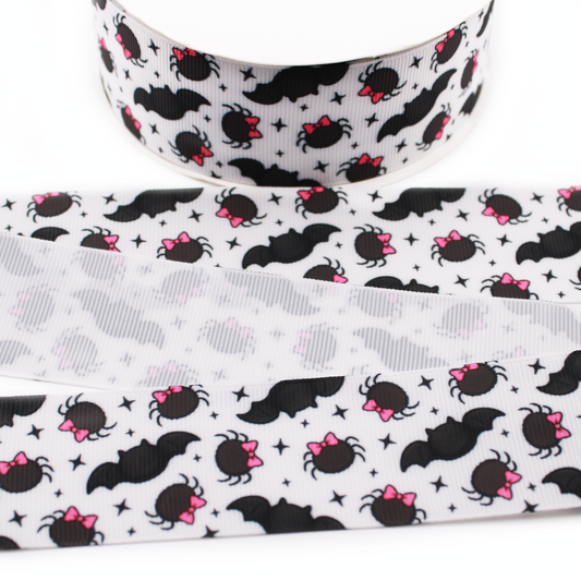 Bats and Spiders printed grosgrain ribbon with black bats, spiders with pink bows and black stars on a white background.