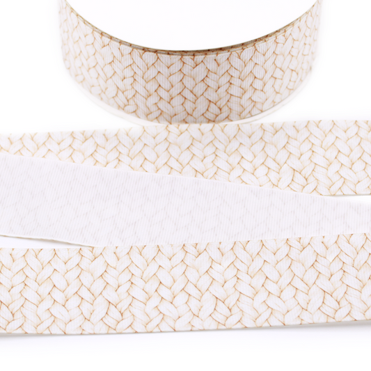 Cream cable knit printed grosgrain ribbon featuring a realistic braided sweater pattern with warm beige detailing.