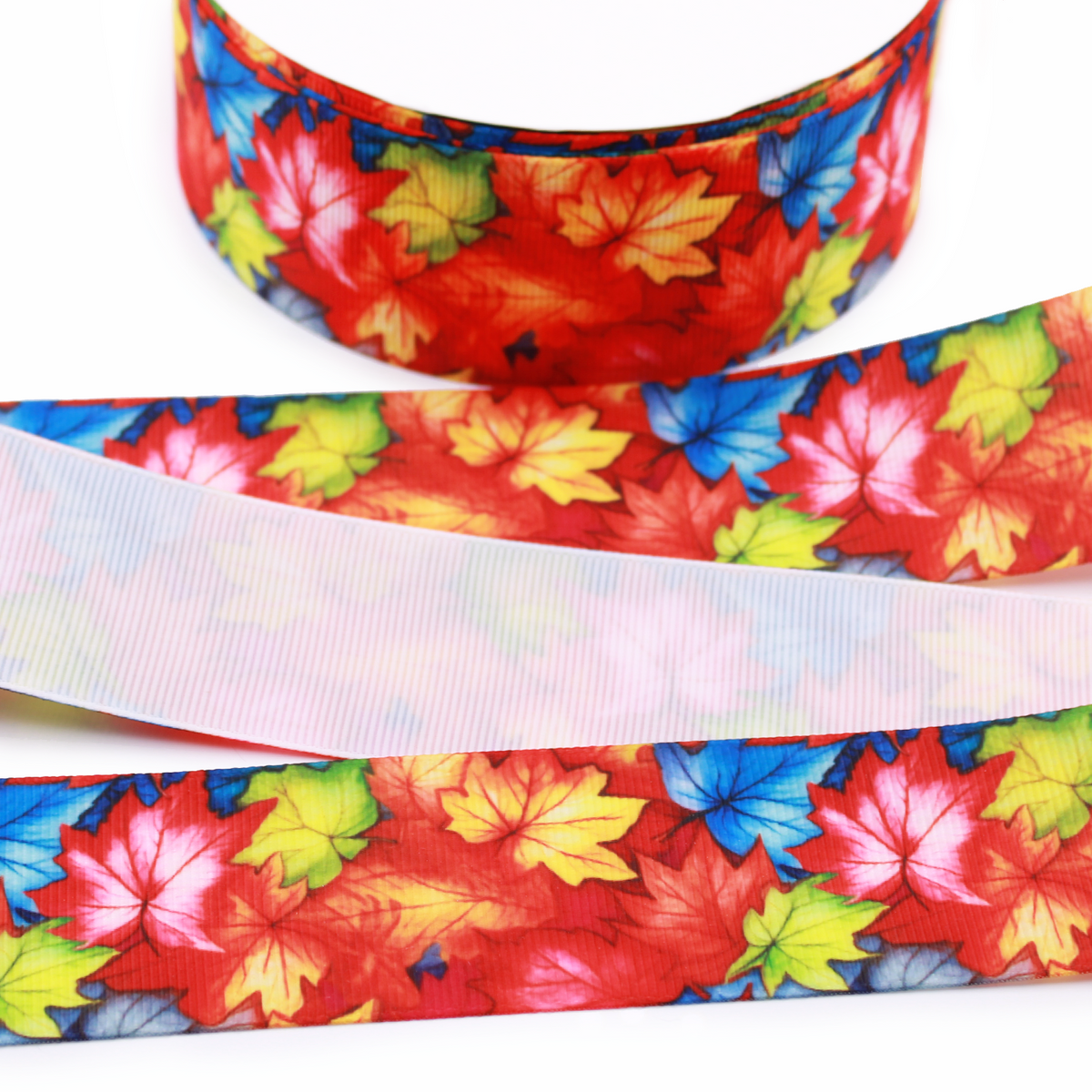 Fall Leaves printed grosgrain ribbon with colorful red, orange, yellow, green and blue autumn leaves.