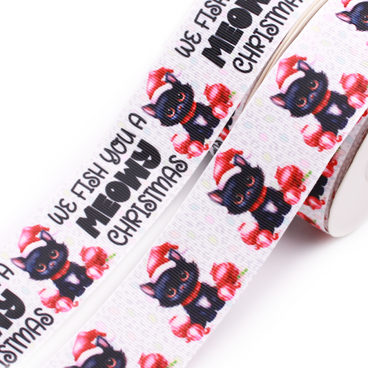 Meowy Christmas printed grosgrain ribbon with a black cat wearing a red Santa hat surrounded by red Christmas ornaments on a white background.